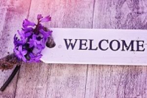 Welcome note and purple flowers